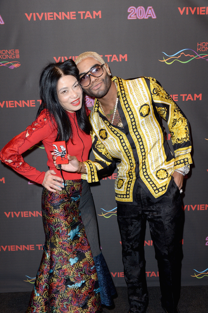 Designer Vivienne Tam and “guest,” aka Not Sisqó (Image via Getty)